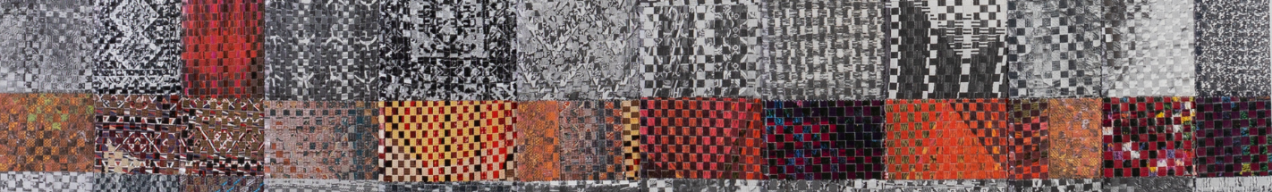 close up image of textile artwork mainly black and white with some square colours